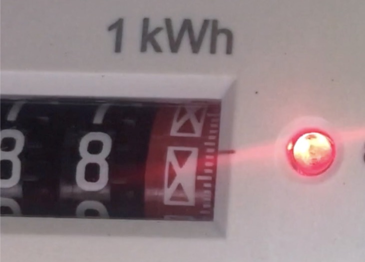 The flashing red light on the front of an electricity meter
