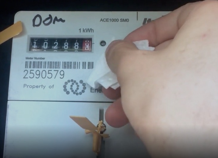 Wiping the meter face around the red light with an alcohol wipe
