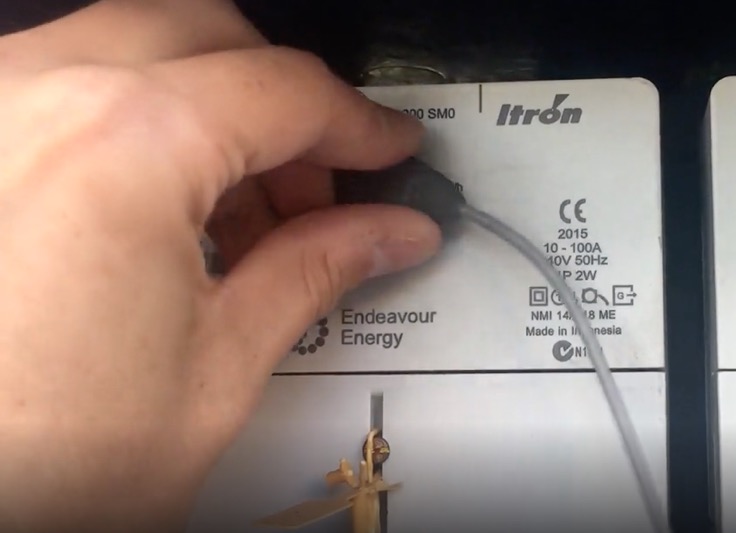 Twisting the Powerpal sensor into the mounting plate